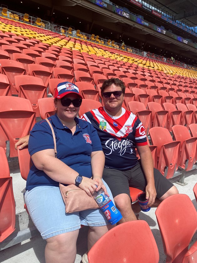 Amie Warner and Dean Lovelock were the first fans through the gate to see the Dolphins take on the Roosters in Round 1 at Suncorp Stadium.