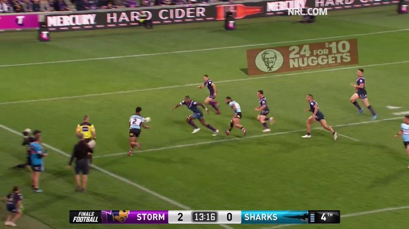 Billy Slater prepares to cut off Sosaia Feki